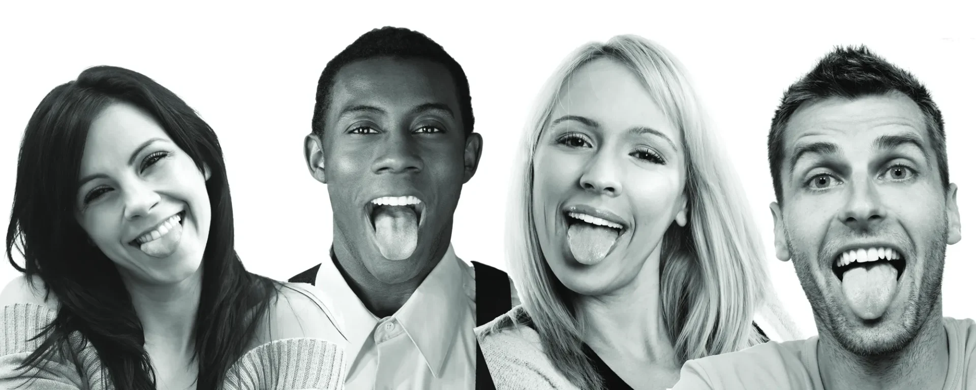 A man and woman sticking out their tongue.